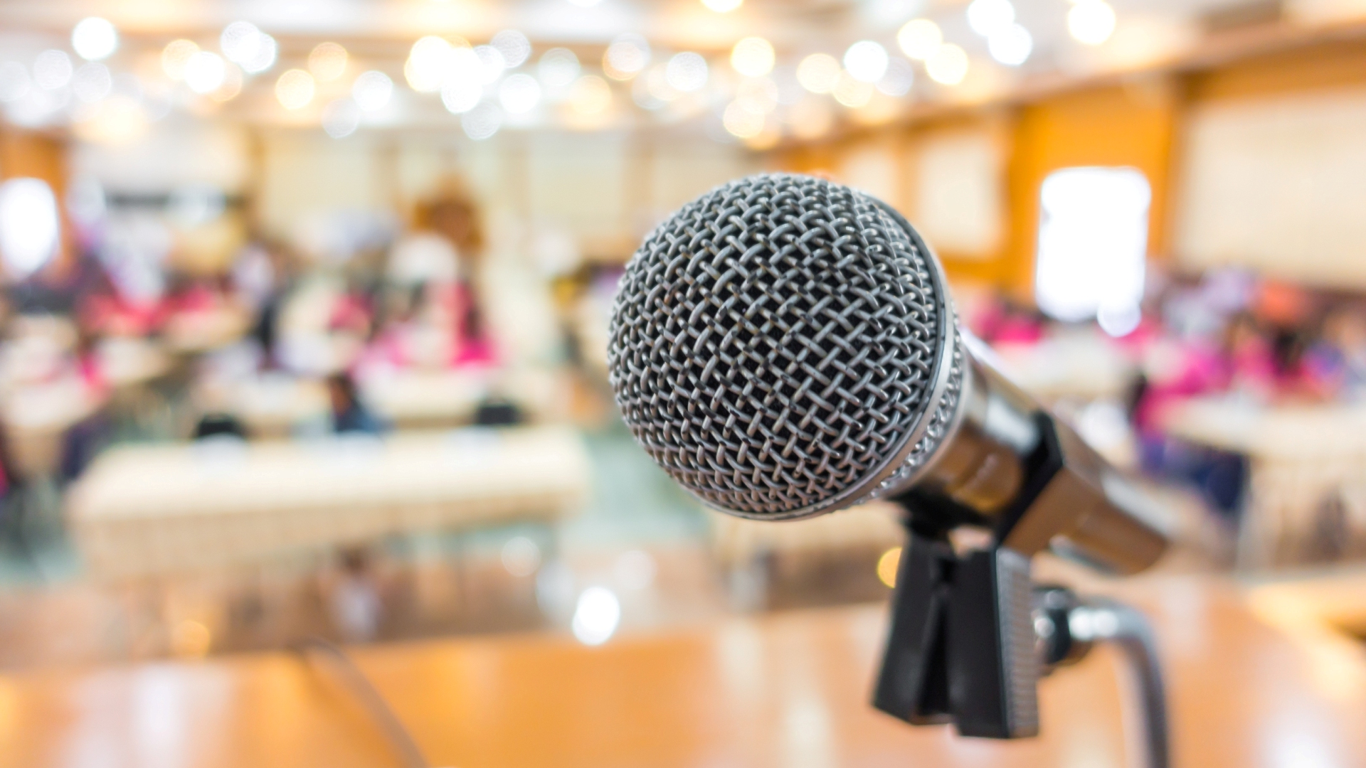Black microphone in conference room .